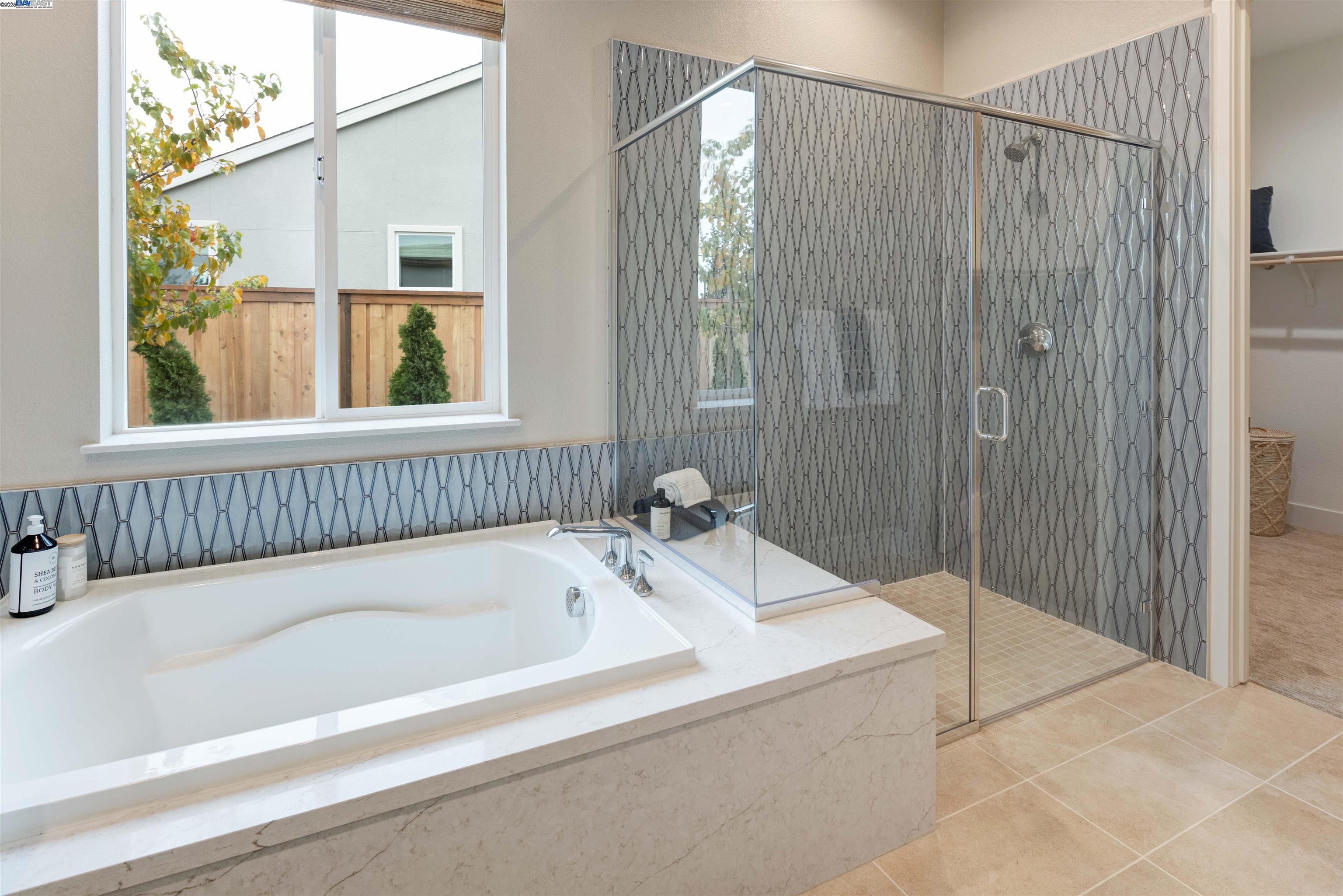 1371 Crescent Avenue Manteca, CA 95336 - Photo 25 of 55 a bathroom with a bathtub and shower