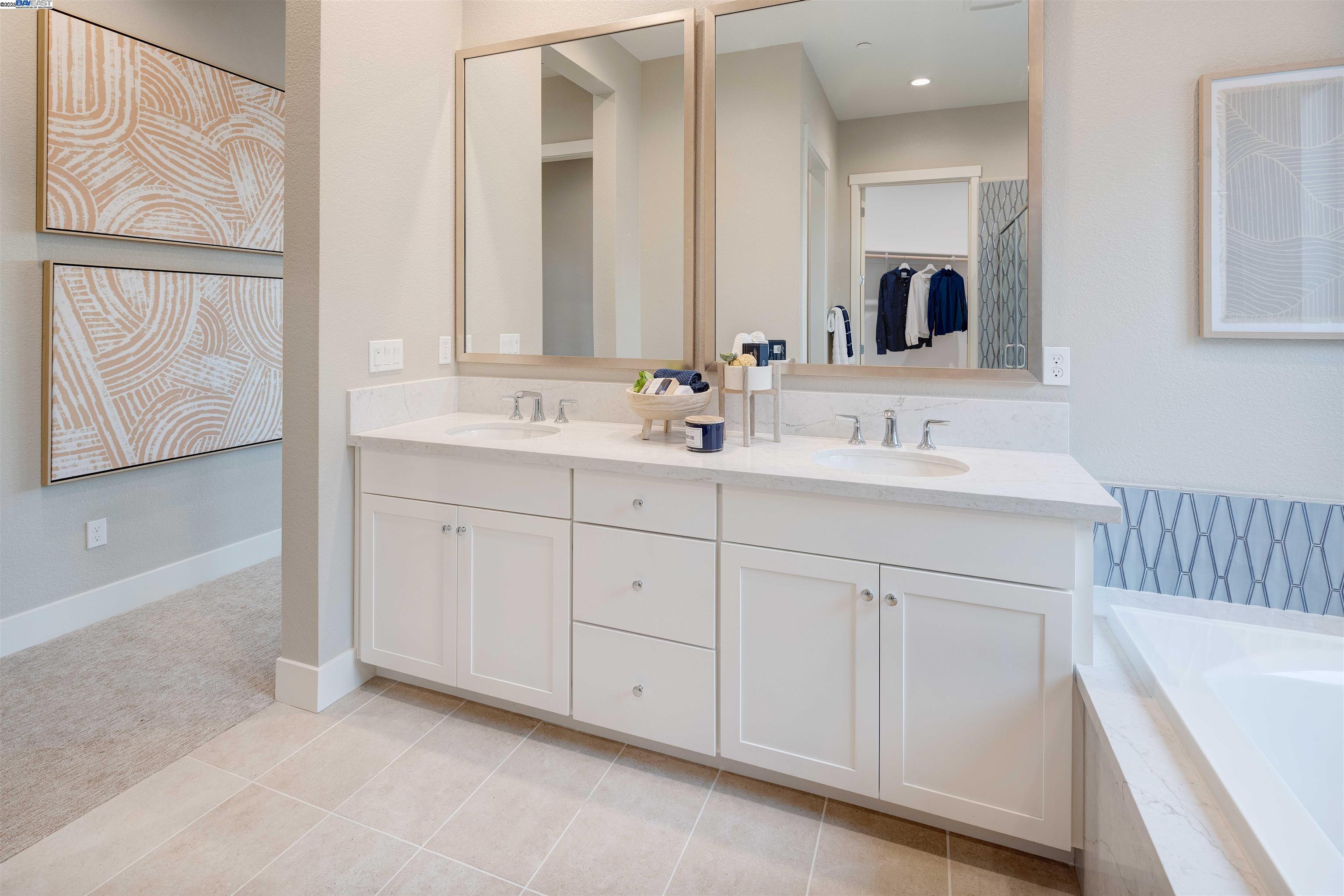 1371 Crescent Avenue Manteca, CA 95336 - Photo 27 of 55 a bathroom with a double vanity sink and mirror