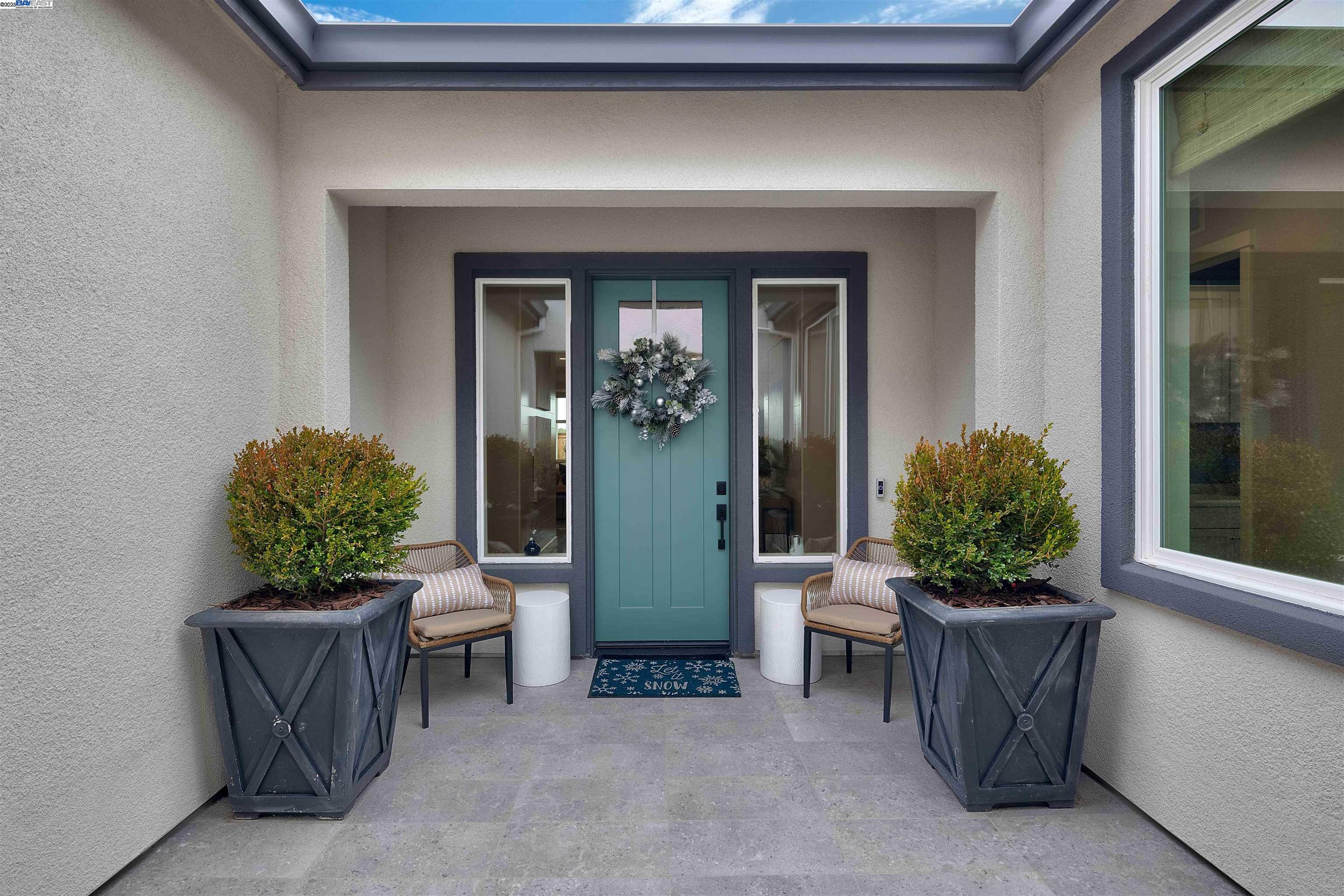 1371 Crescent Avenue Manteca, CA 95336 - Photo 3 of 55 a potted plant sitting in front of a door
