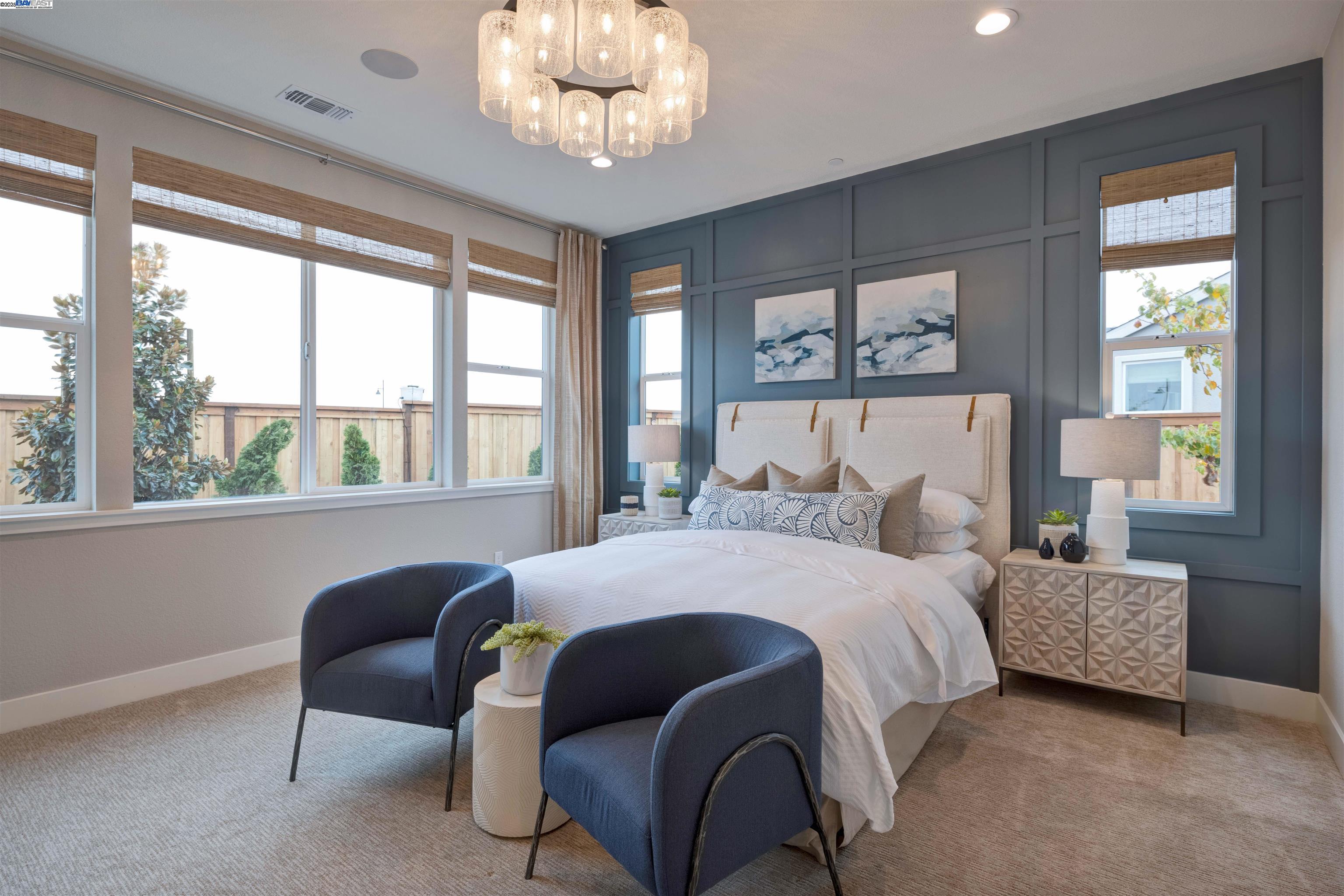 1371 Crescent Avenue Manteca, CA 95336 - Photo 33 of 55 a bedroom with a bed and a chandelier