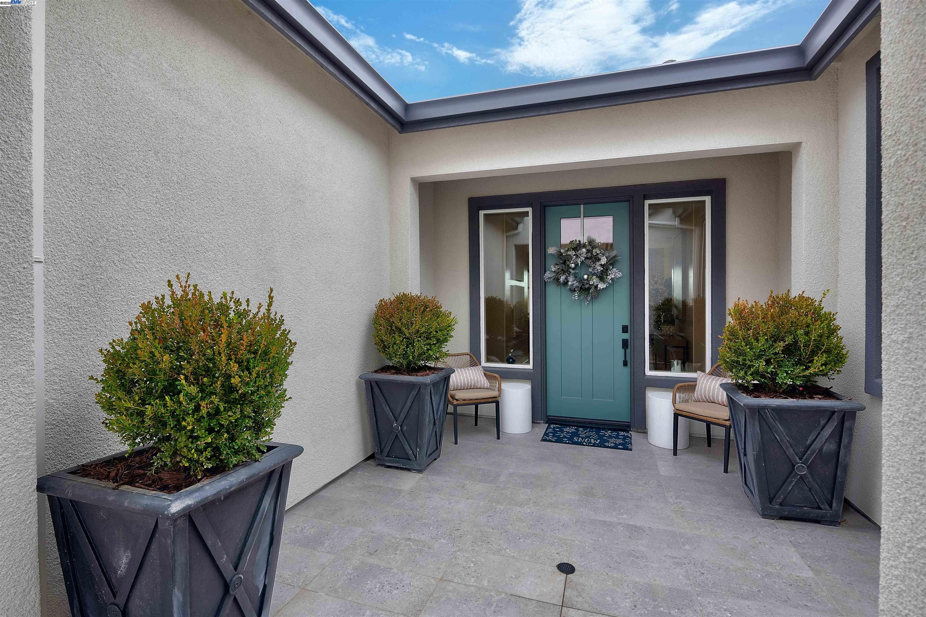 1371 Crescent Avenue Manteca, CA 95336 - Photo 4 of 55 a view of a entryway door and potted plants