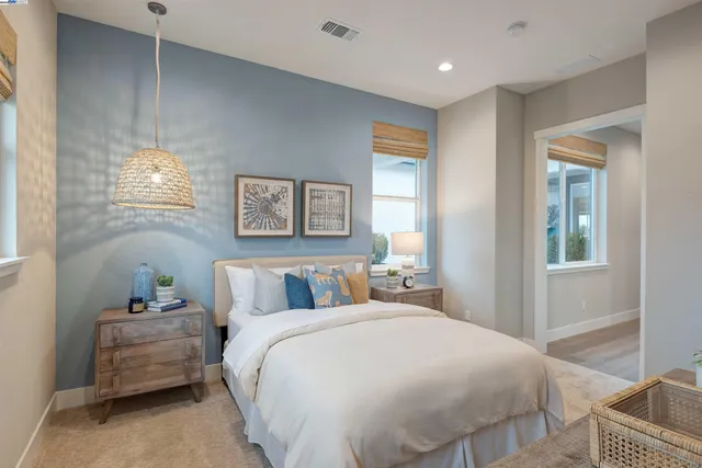 a bedroom with a bed and a dresser