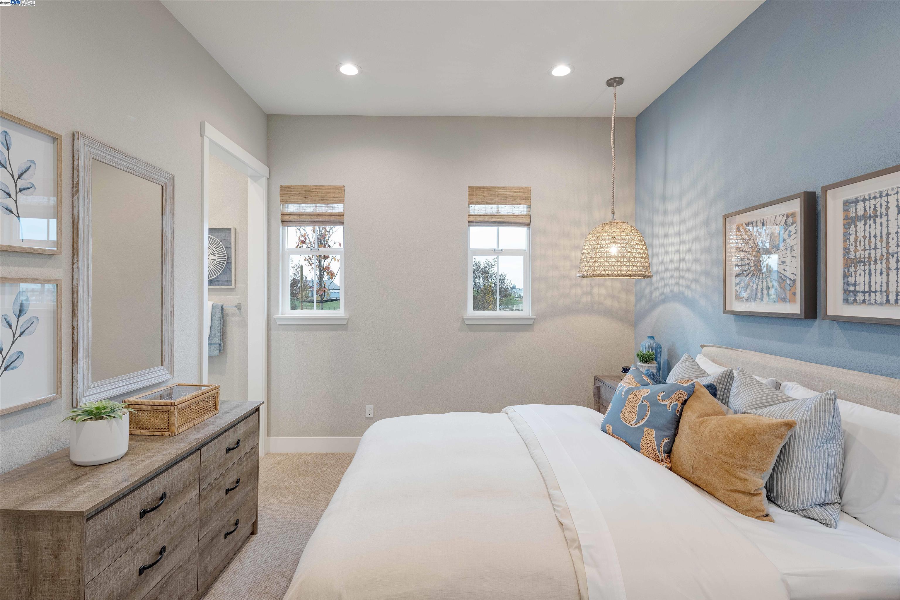 1371 Crescent Avenue Manteca, CA 95336 - Photo 44 of 55 a bedroom with a bed and dresser with mirror