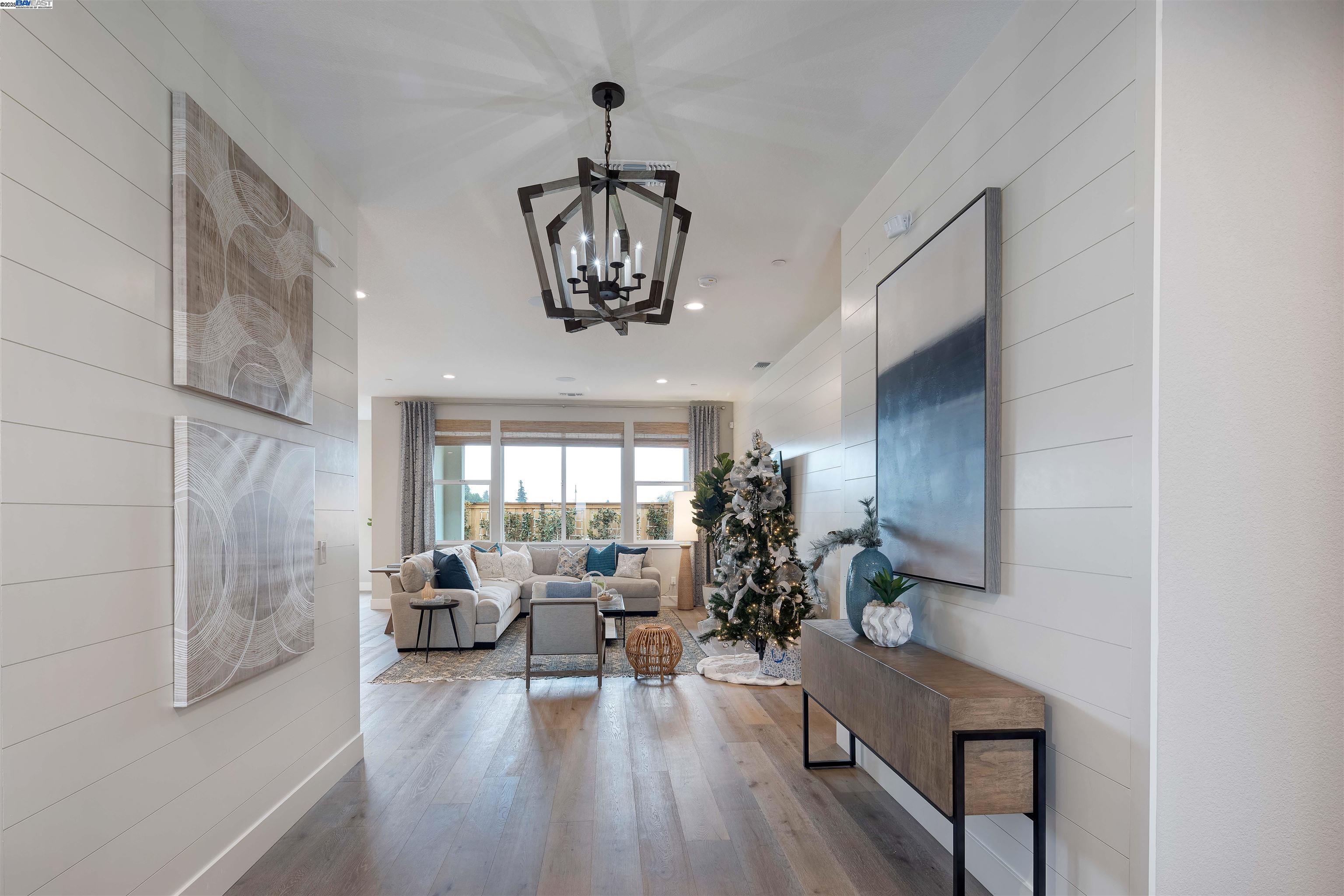 1371 Crescent Avenue Manteca, CA 95336 - Photo 5 of 55 a view of a dining room with furniture wooden floor and chandelier