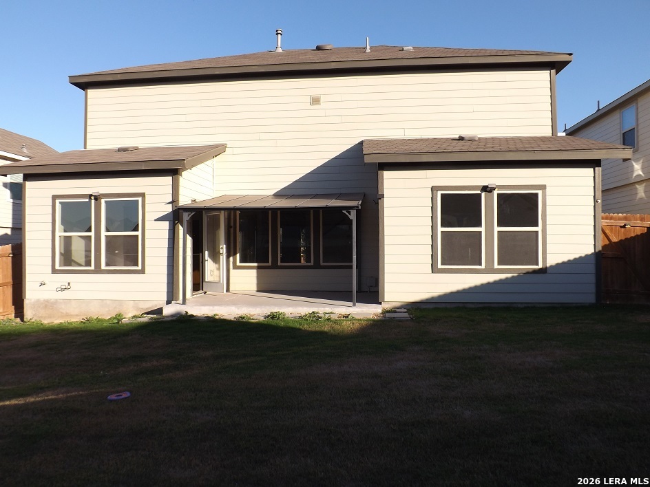 6835 Alaskan Wy. Converse, TX 78109 - Photo 21 of 22 a front view of a house with a garden