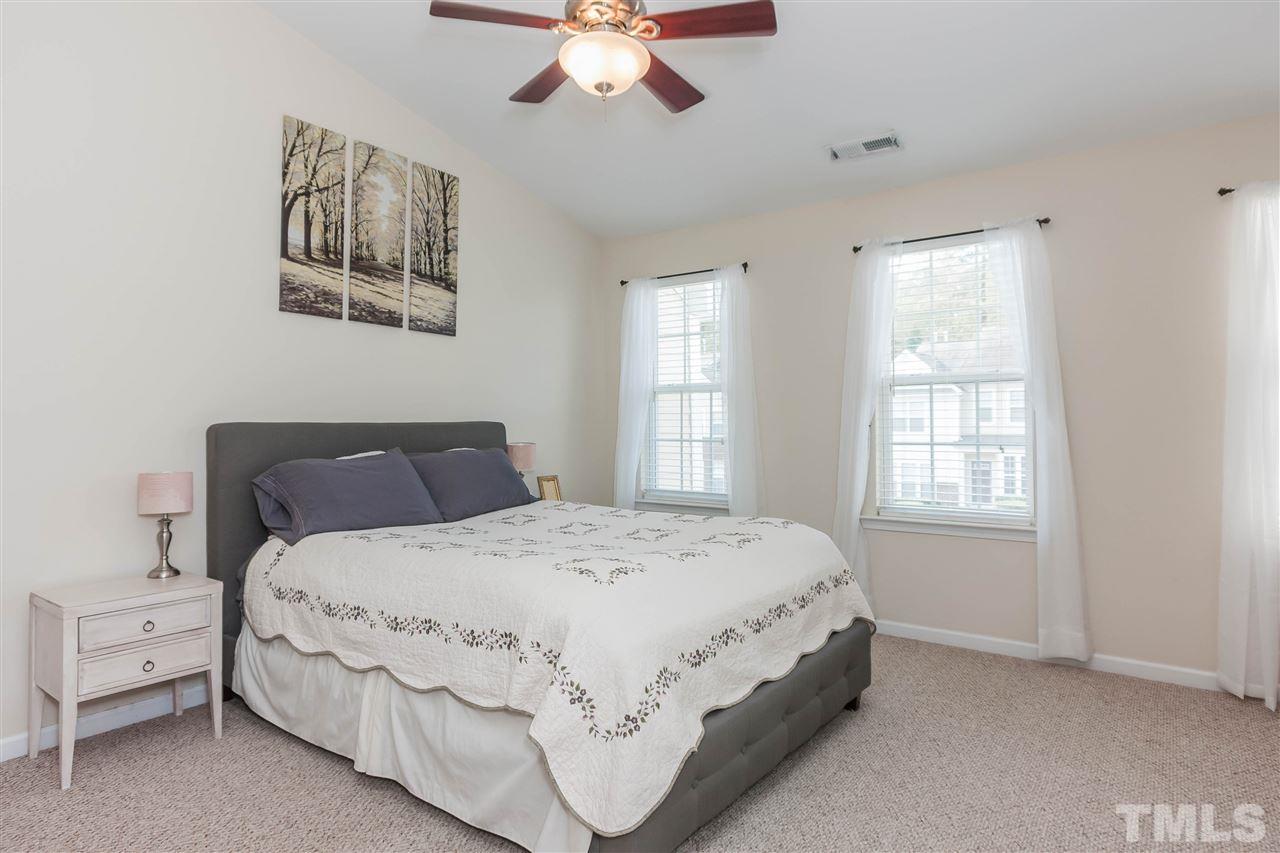 4424 Sugarbend Way Raleigh, NC 27606 - Photo 11 of 22 The large master suite offers a private bath with extended vanity.