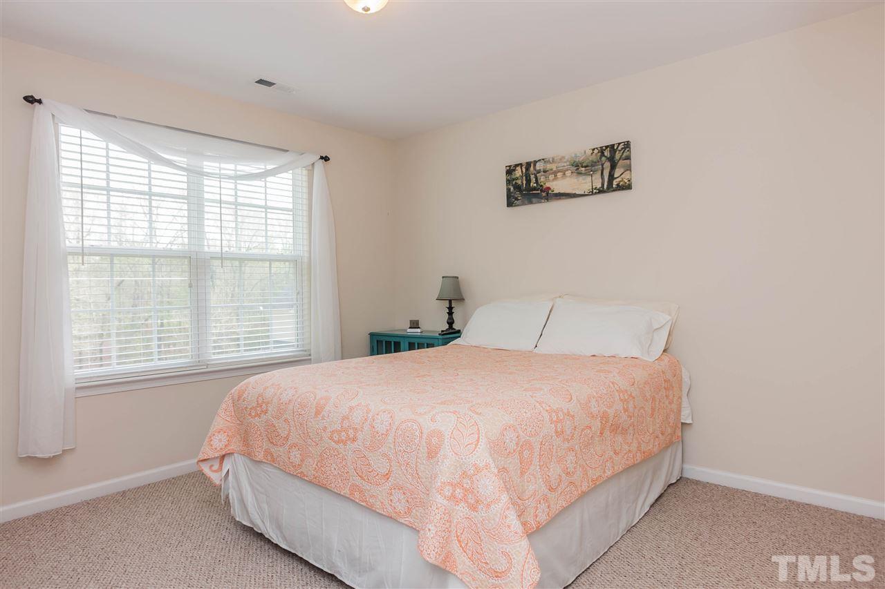 4424 Sugarbend Way Raleigh, NC 27606 - Photo 15 of 22 The spacious secondary bedroom with nearby full bath is perfect for a 2nd master, guest or office.