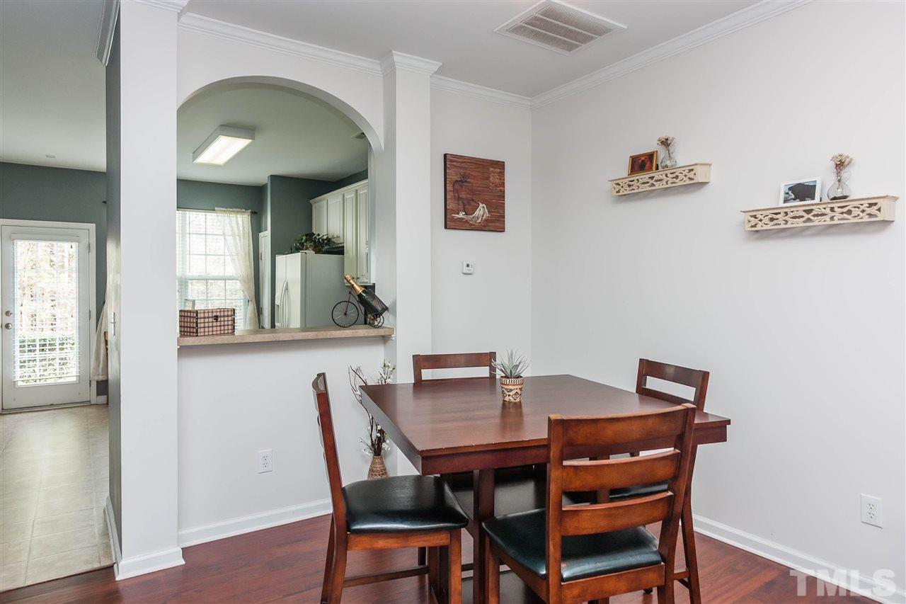 4424 Sugarbend Way Raleigh, NC 27606 - Photo 6 of 22 The kitchen has a pass through to the dining room for the easy flow of modern life-styles.