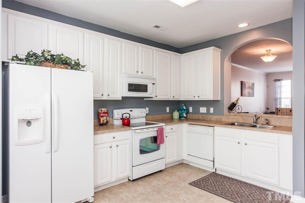 4424 Sugarbend Way Raleigh, NC 27606 - Photo 7 of 22 Extensive counters plus a pantry provide plenty of work space & storage.