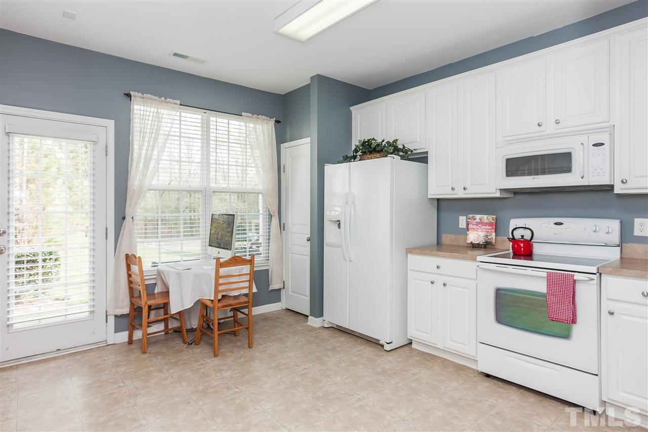 4424 Sugarbend Way Raleigh, NC 27606 - Photo 8 of 22 Enjoy the spacious kitchen with breakfast area and included refrigerator!