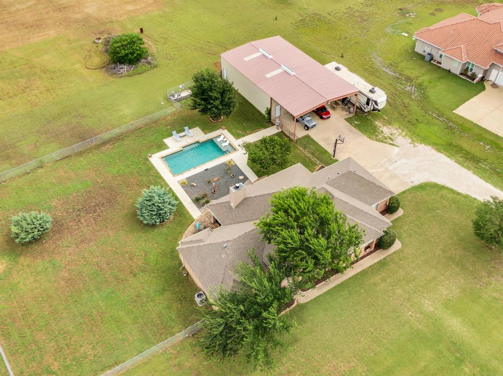 431 Mc Alpin Road Midlothian, TX 76065 - Photo 18 of 18 Aerial property view featuring a rectangular swimming pool with surrounding patio space