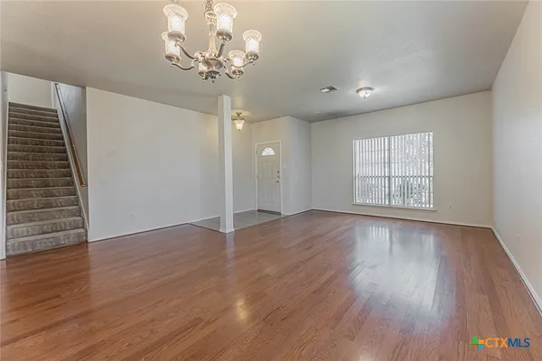 a kitchen with stainless steel appliances granite countertop a refrigerator stove top oven a sink and dishwasher