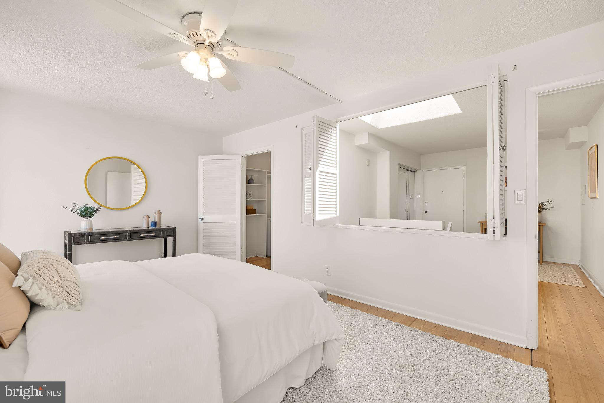 1800 R Street Northwest, Unit 807 Washington, DC 20009 - Photo 20 of 23 a bedroom with a large bed and a chandelier