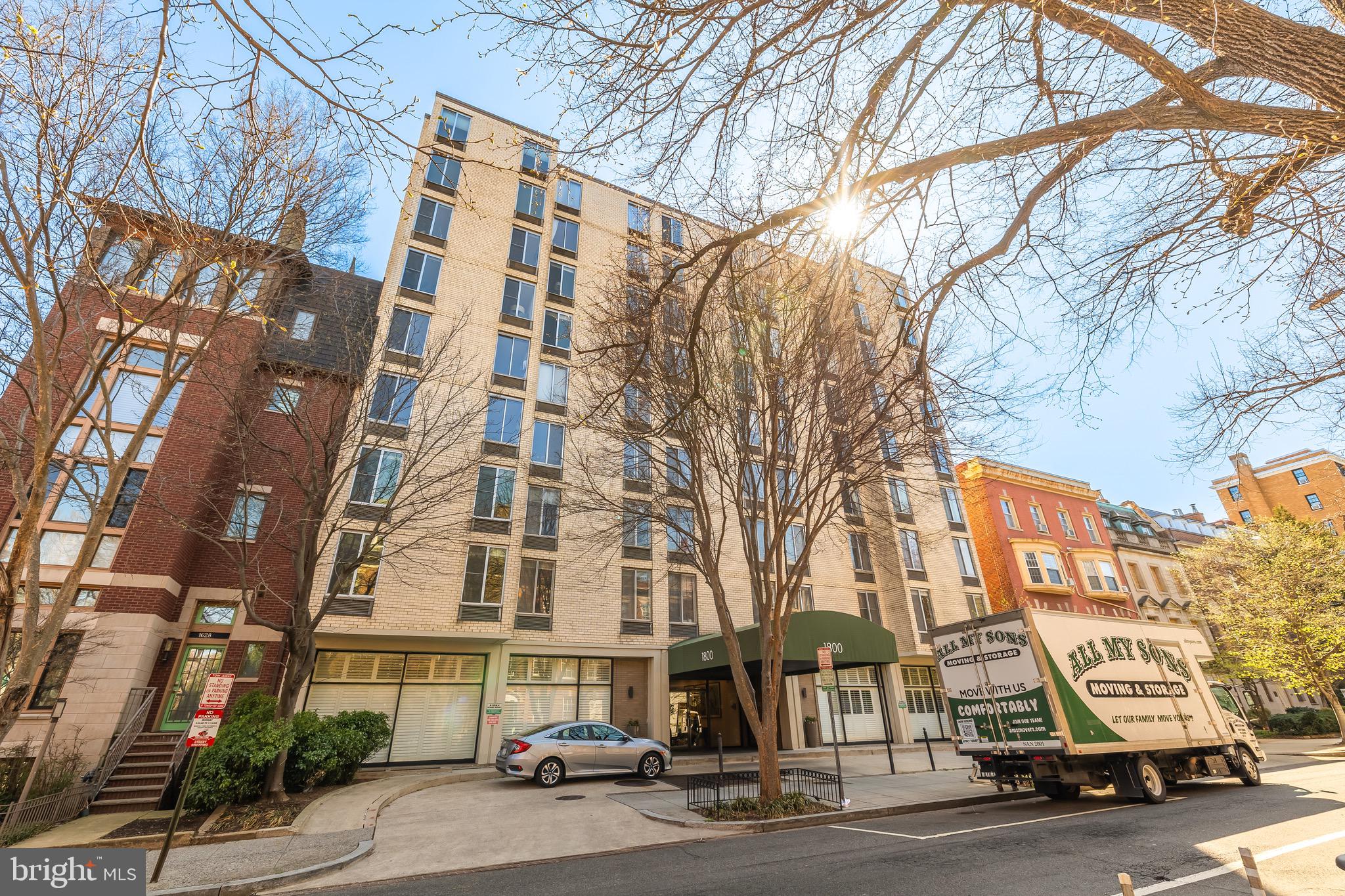 1800 R Street Northwest, Unit 807 Washington, DC 20009 - Photo 2 of 23 a city street lined with buildings and cars