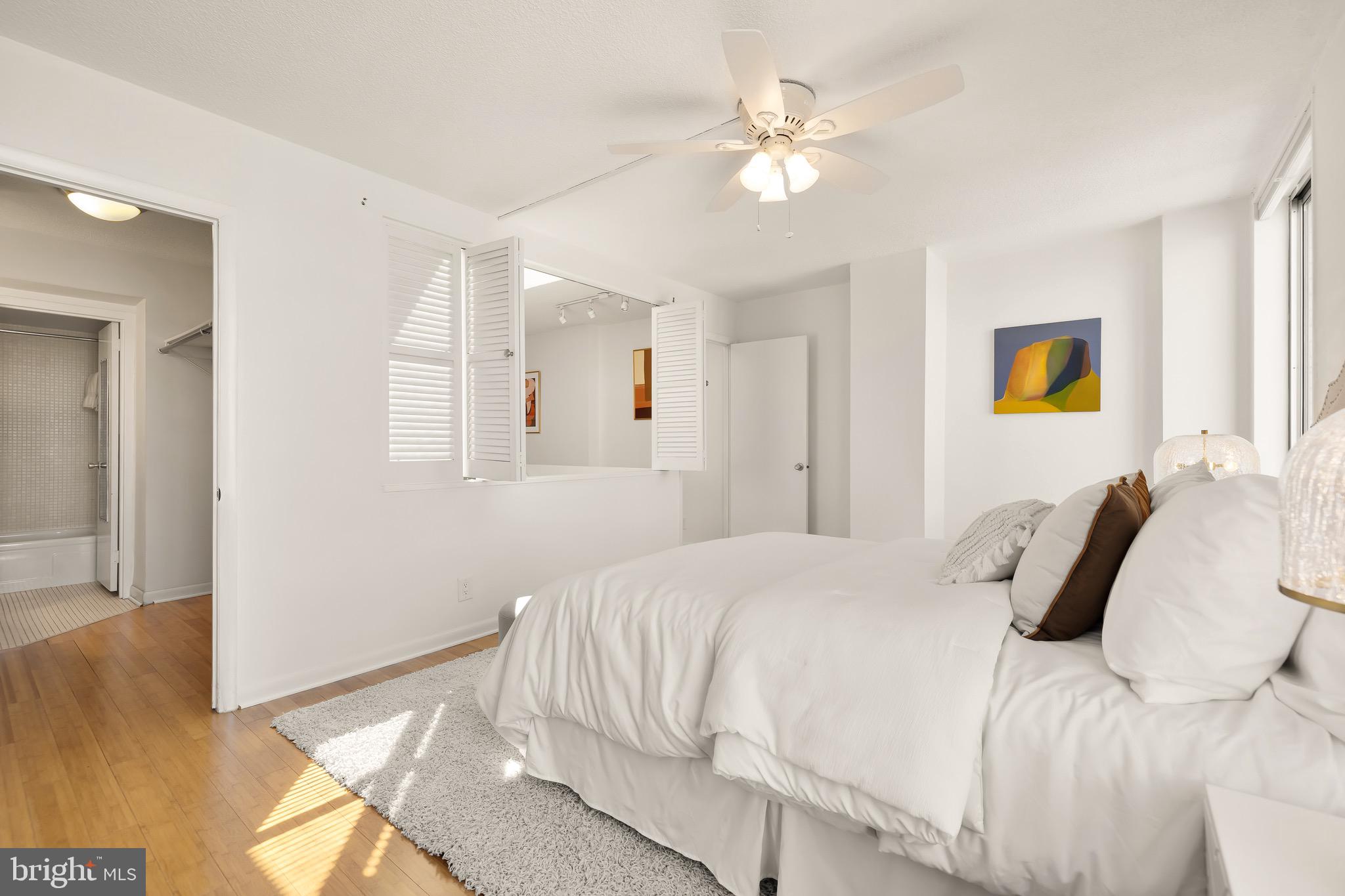 1800 R Street Northwest, Unit 807 Washington, DC 20009 - Photo 21 of 23 a bedroom with a bed and a chandelier