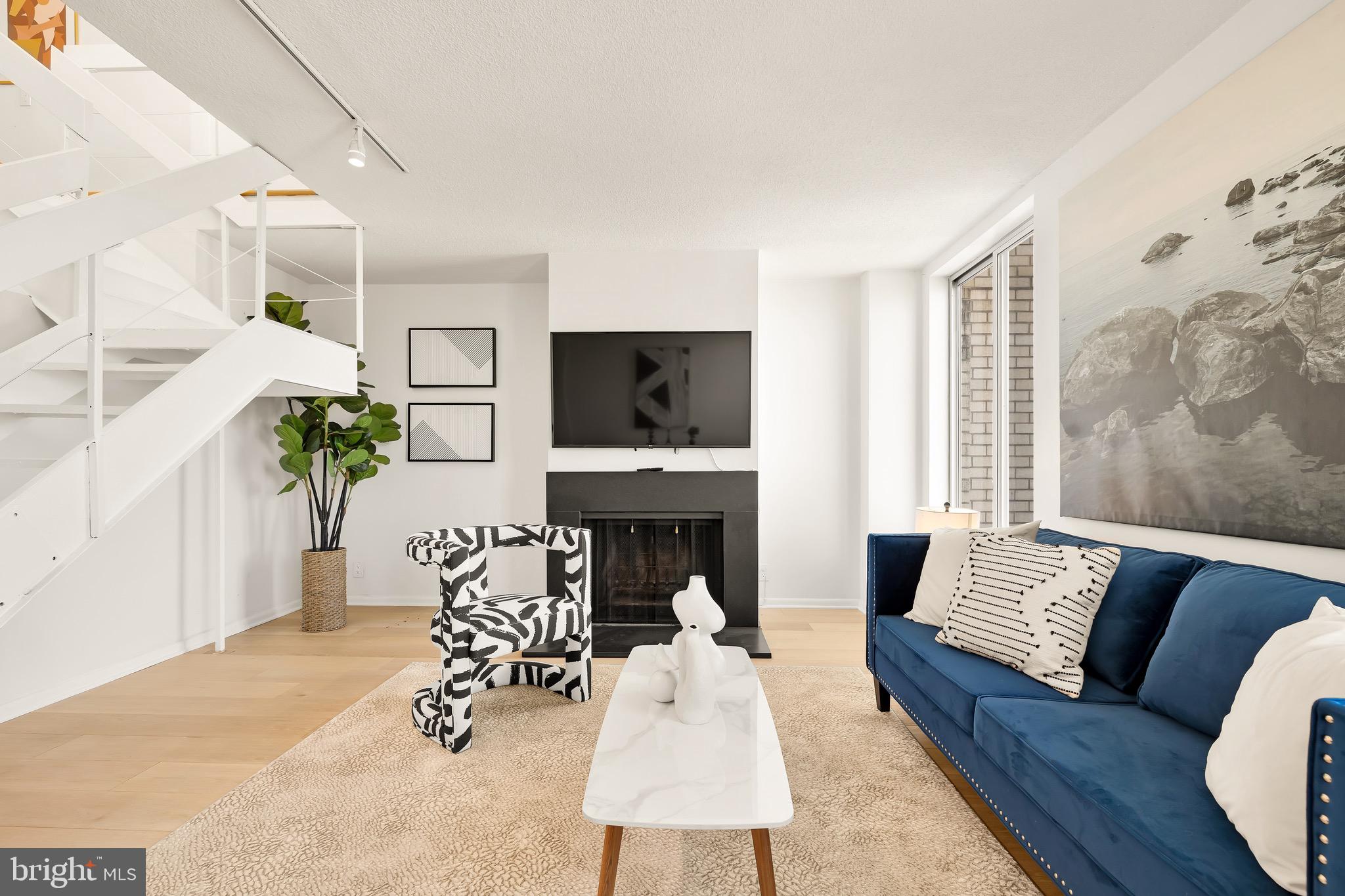 1800 R Street Northwest, Unit 807 Washington, DC 20009 - Photo 3 of 23 a living room with furniture fireplace and lamp