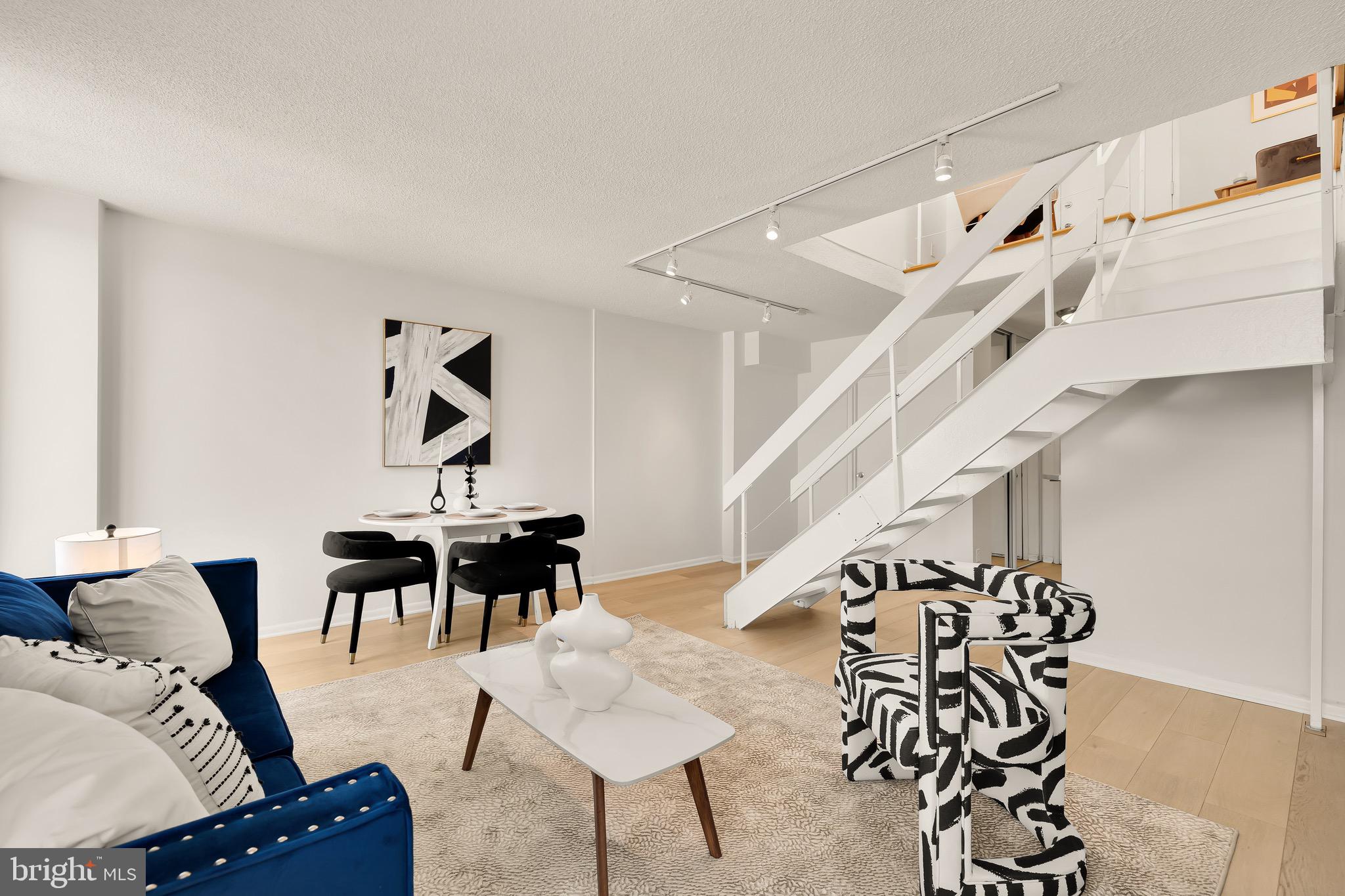 1800 R Street Northwest, Unit 807 Washington, DC 20009 - Photo 8 of 23 a living room with furniture and wooden floor