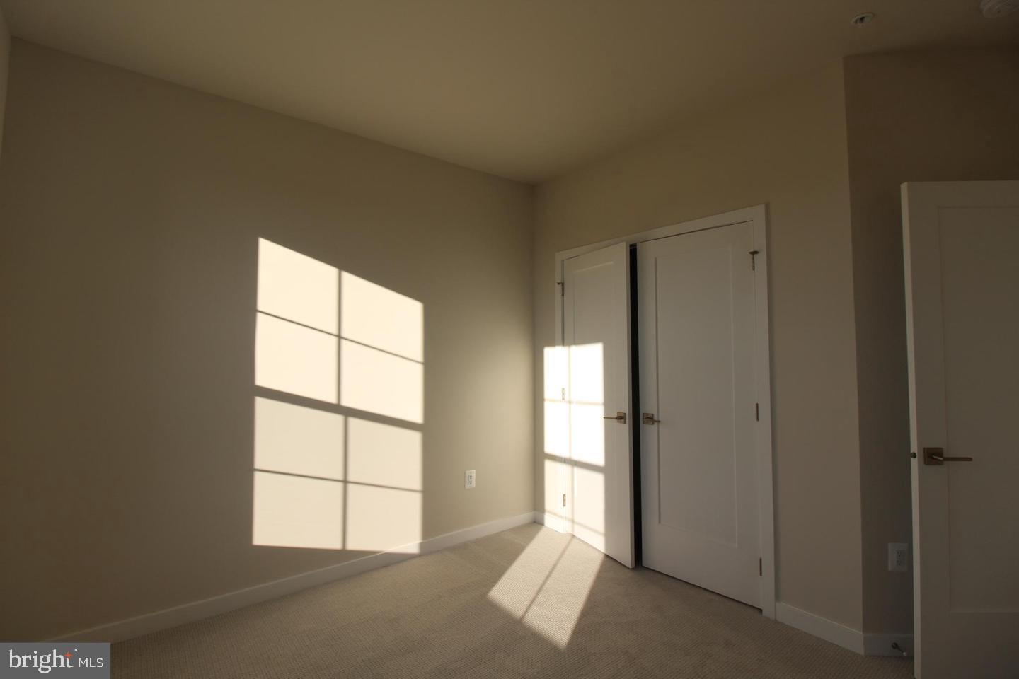 22383 Roanoke Rise Terrace Ashburn, VA 20148 - Photo 37 of 41 an empty room with windows and closet