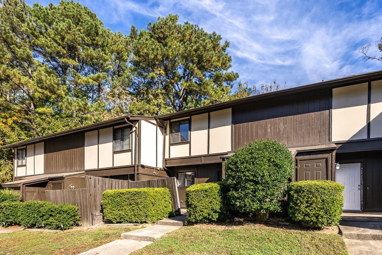4265 Lake Ridge Drive, Unit 7C Raleigh, NC 27604 - Photo 1 of 19 a front view of a house with garden