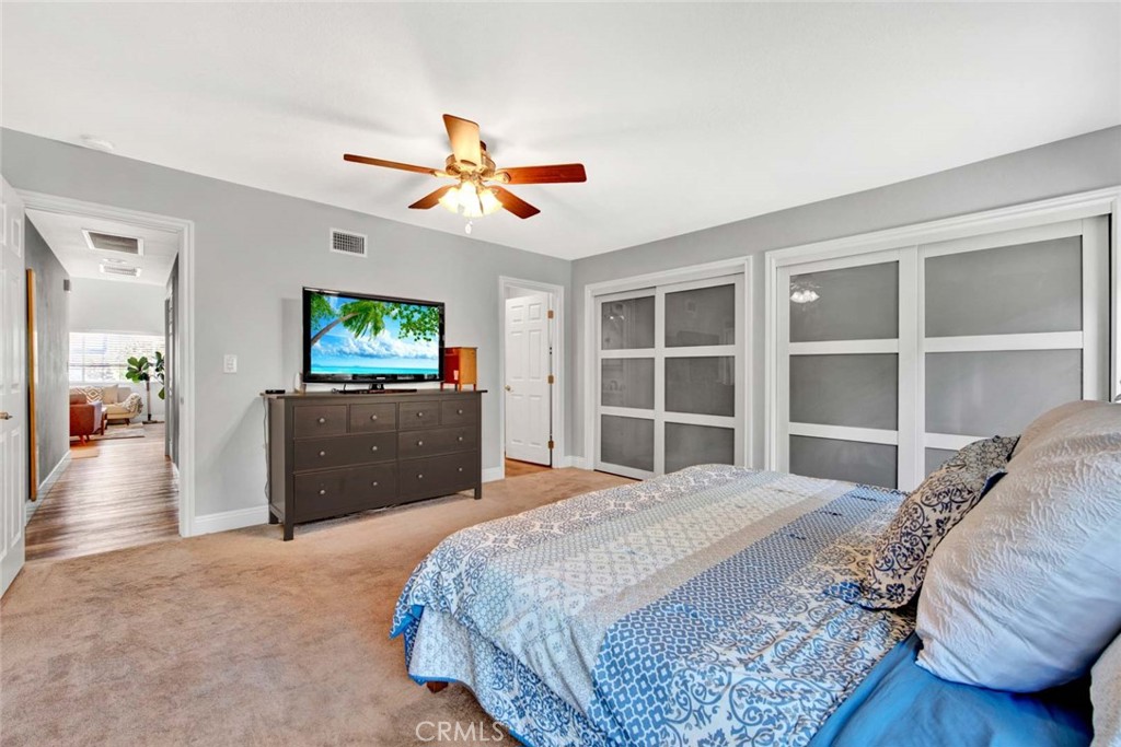 14762 Bridgeport Road Tustin, CA 92780 - Photo 14 of 29 a bedroom with a bed and a flat screen television