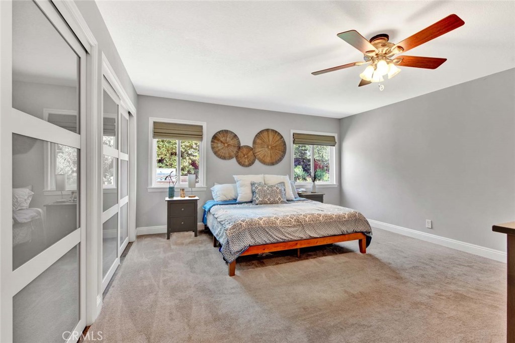 14762 Bridgeport Road Tustin, CA 92780 - Photo 15 of 29 a spacious bedroom with a bed and window