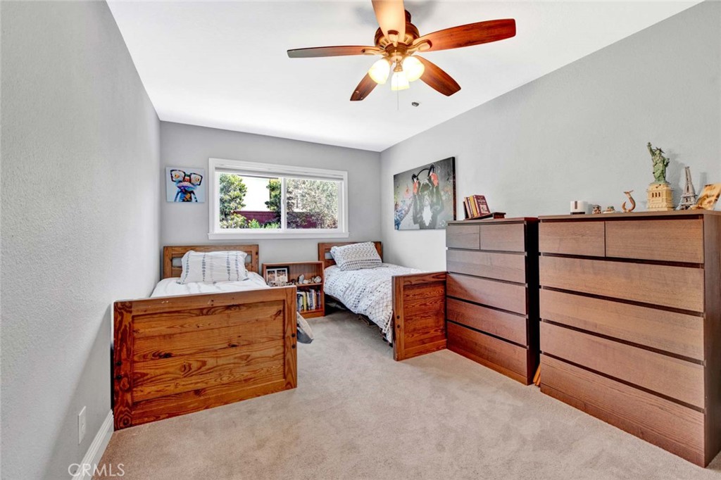 14762 Bridgeport Road Tustin, CA 92780 - Photo 18 of 29 a bedroom with a bed and a chandelier