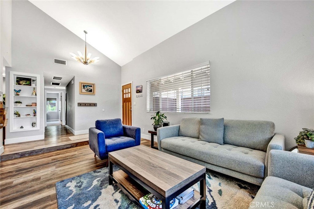 14762 Bridgeport Road Tustin, CA 92780 - Photo 4 of 29 a living room with furniture a rug and a large window