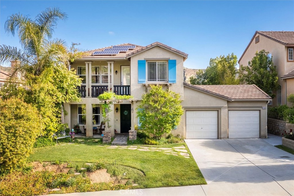 28325 Cascade Road Castaic, CA 91384 - Photo 1 of 1 a front view of a house with garden