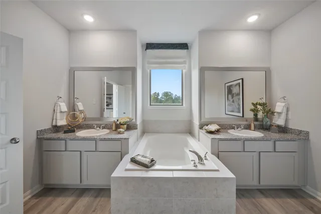 a room with two sink a washer and dryer