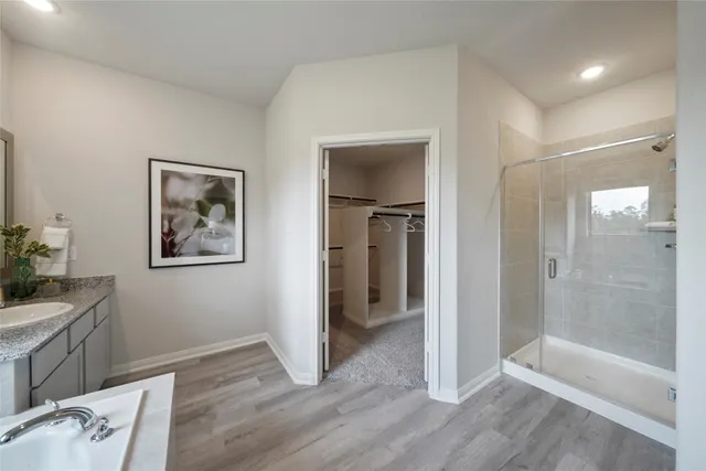 a view of an empty room and bathroom