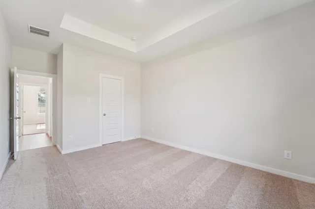 a view of an empty room and closet