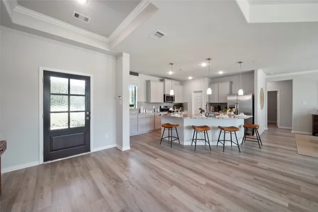 a view of a dining room with furniture and wooden floor