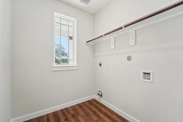 a view of small space with wooden floor and windows