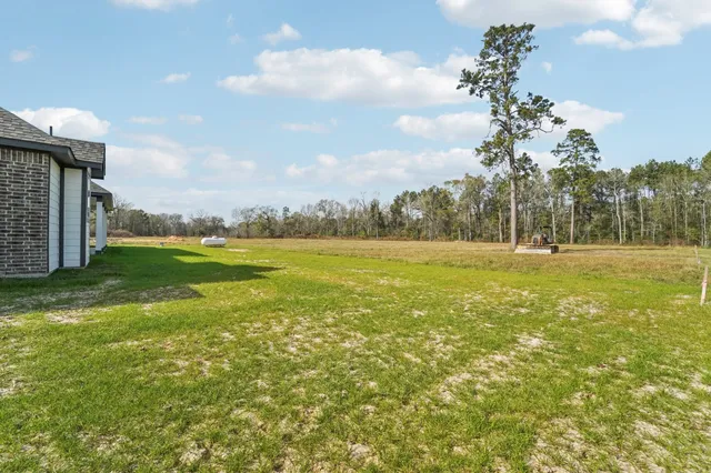 a view of outdoor space with deck and yard