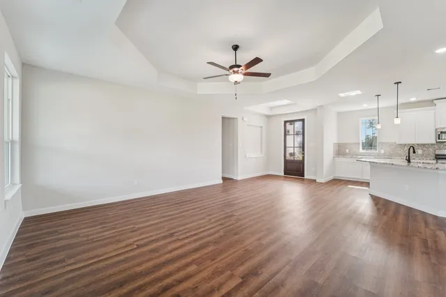 a view of a kitchen with a sink and a window
