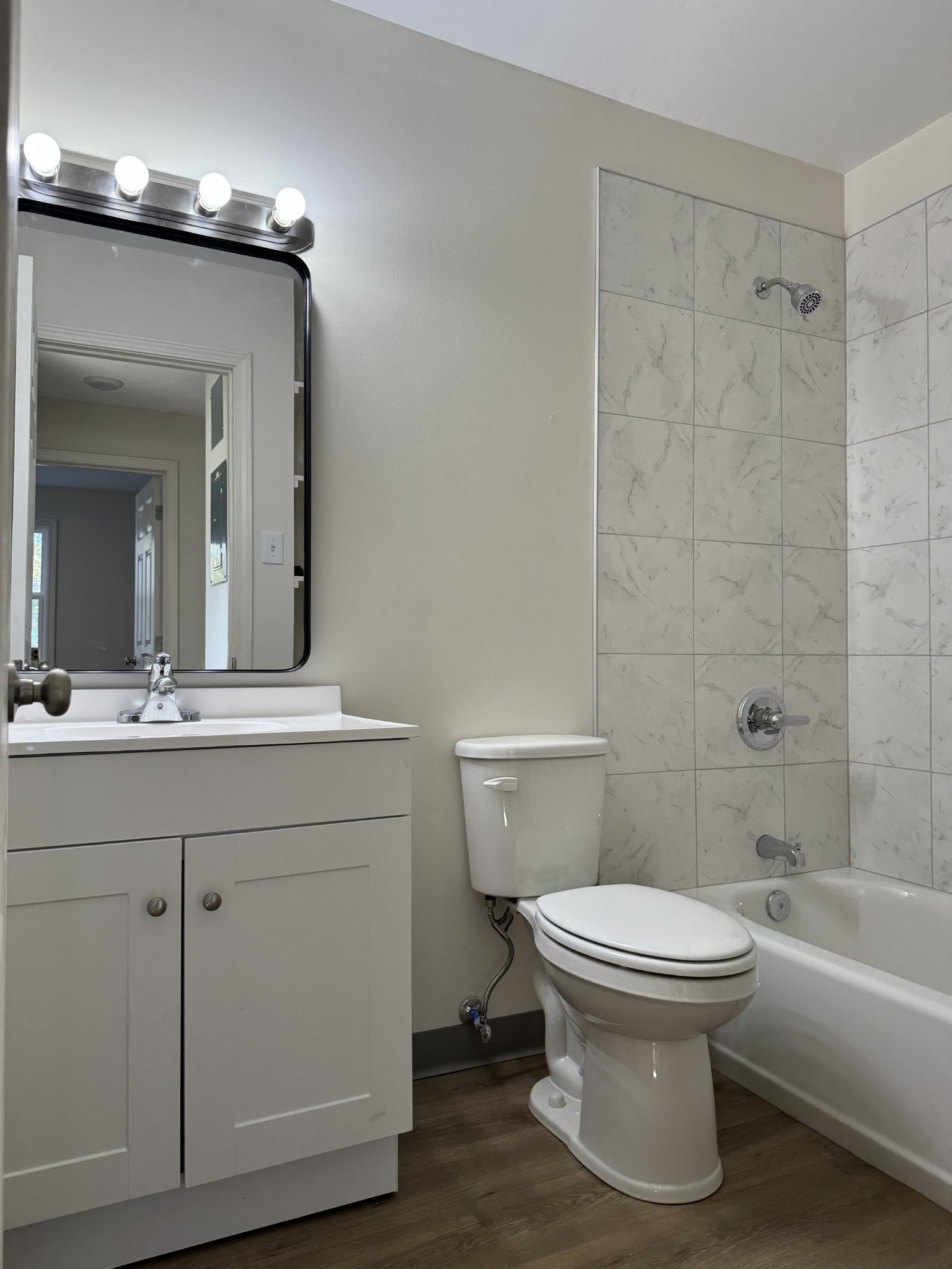 204 South Clydeton Road, Unit A Waverly, TN 37185 - Photo 10 of 14 a bathroom with a sink a toilet and shower
