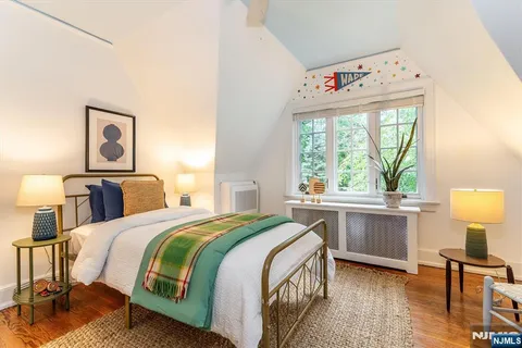 a bedroom with a bed and a table in it