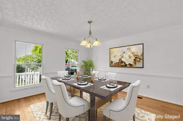 a kitchen with stainless steel appliances granite countertop a sink and a refrigerator