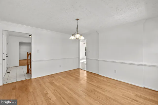 a living room with furniture a rug and a fireplace