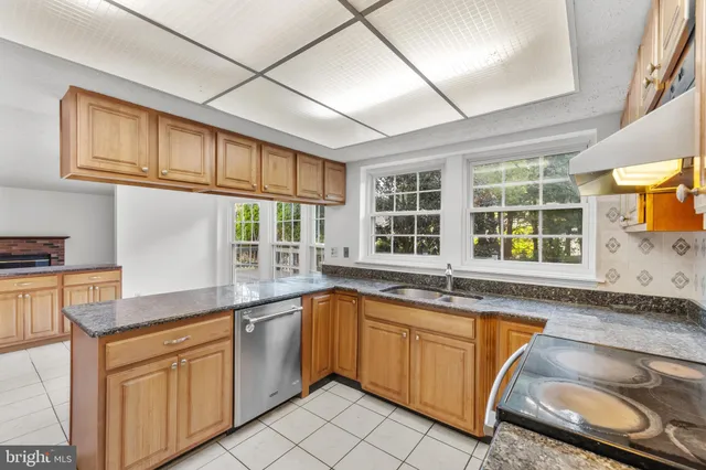 a bathroom with a toilet a sink and shower