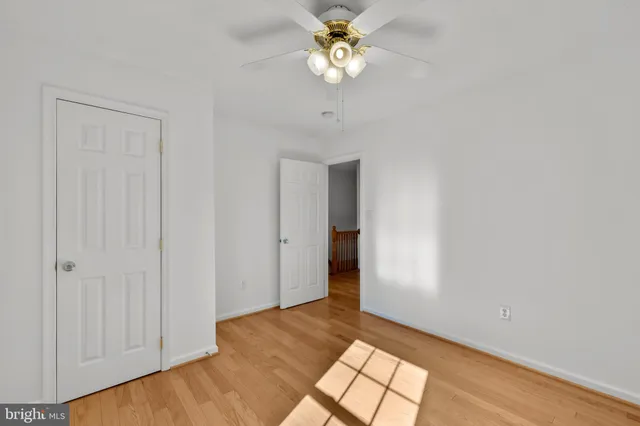 a view of a field with trees in the background