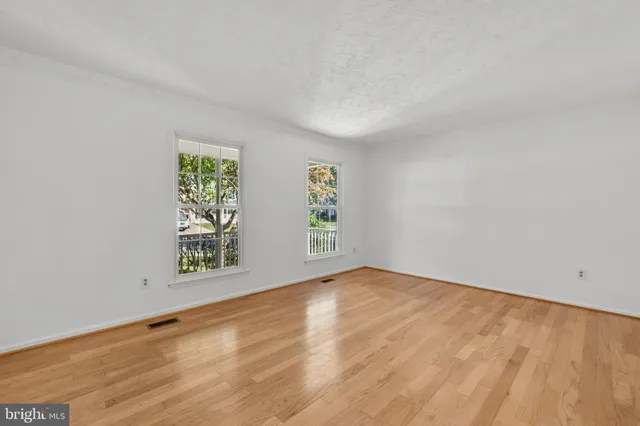 a large kitchen with stainless steel appliances granite countertop a stove a sink dishwasher and a microwave oven with cabinets