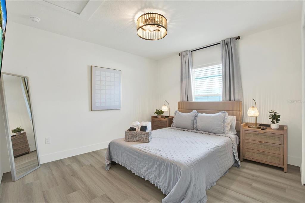 Undisclosed Address Tampa, FL 33607 - Photo 12 of 31 a bedroom with a bed and window