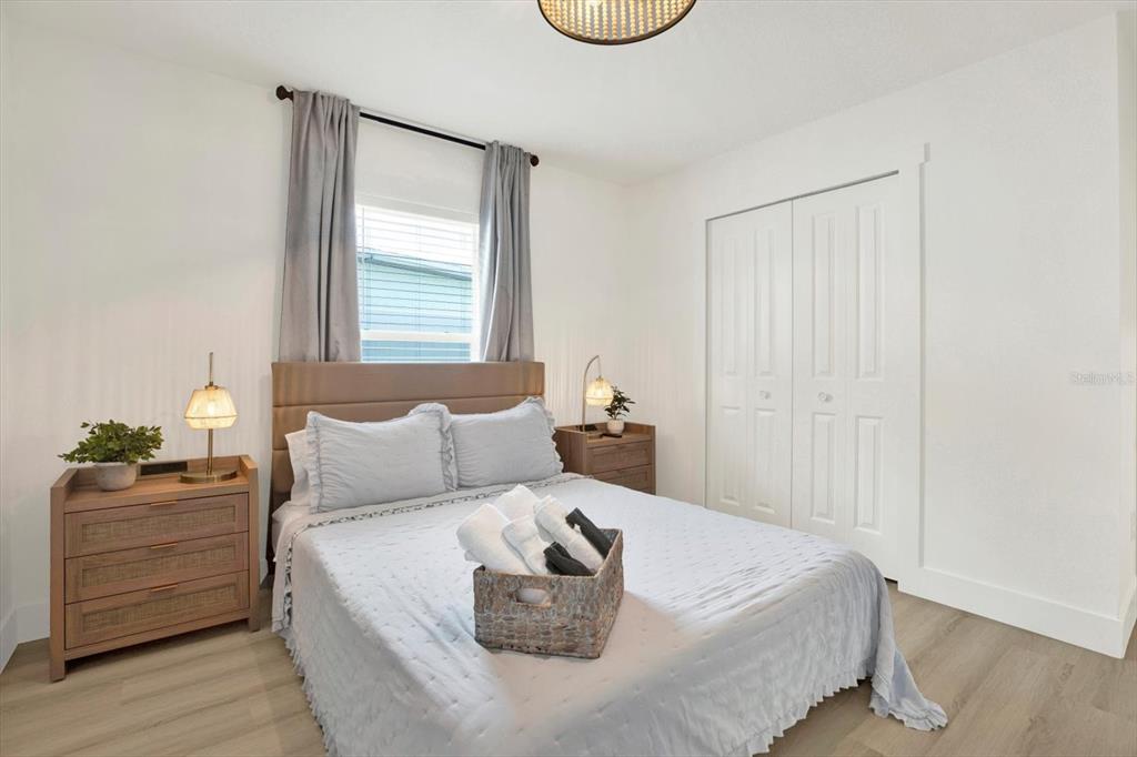 Undisclosed Address Tampa, FL 33607 - Photo 13 of 31 a bedroom with a bed and dresser