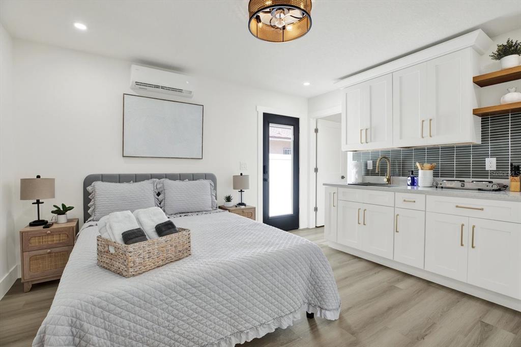 Undisclosed Address Tampa, FL 33607 - Photo 16 of 31 a bedroom with bed and a window