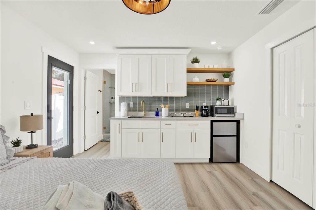 Undisclosed Address Tampa, FL 33607 - Photo 18 of 31 a kitchen with stainless steel appliances granite countertop a refrigerator sink and cabinets