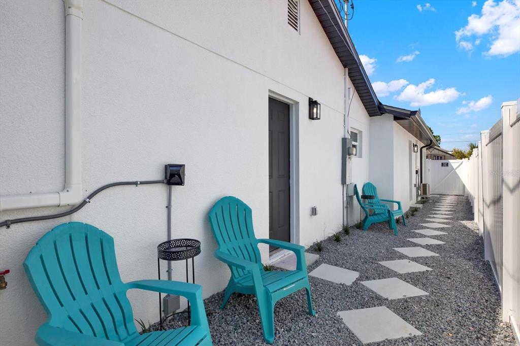 Undisclosed Address Tampa, FL 33607 - Photo 24 of 31 a view of a porch with furniture and a yard