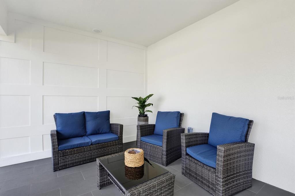 Undisclosed Address Tampa, FL 33607 - Photo 26 of 31 a living room with furniture and a rug