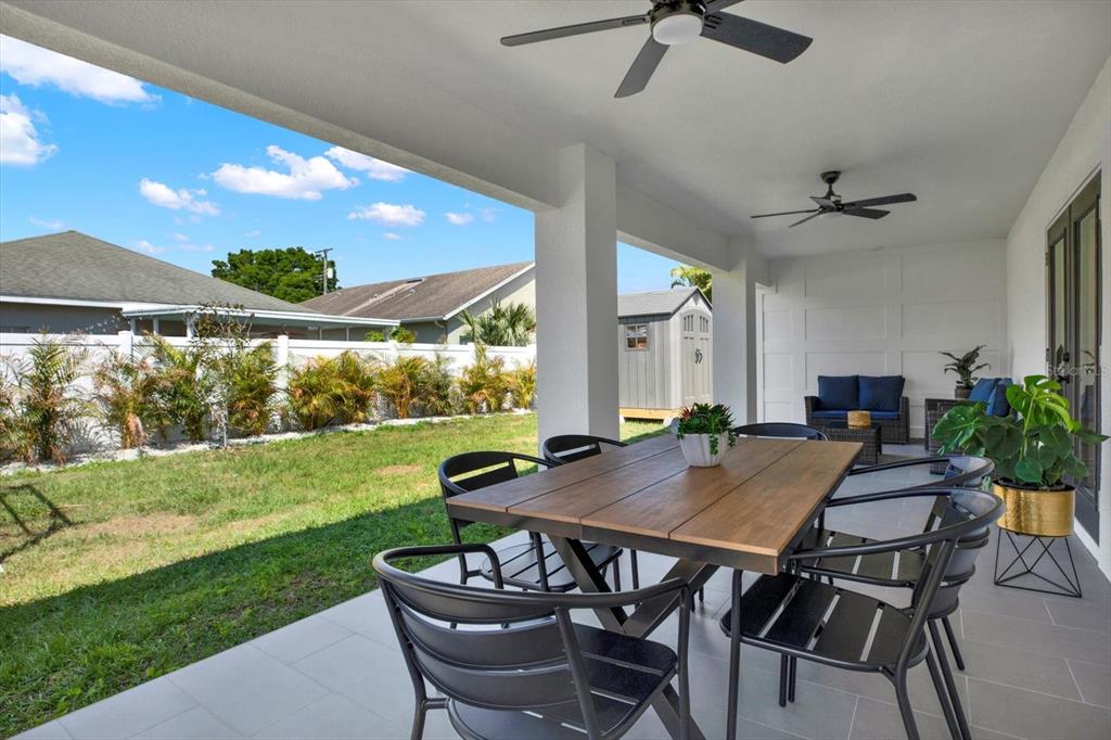 Undisclosed Address Tampa, FL 33607 - Photo 27 of 31 a view of an outdoor dining space with a table and chairs