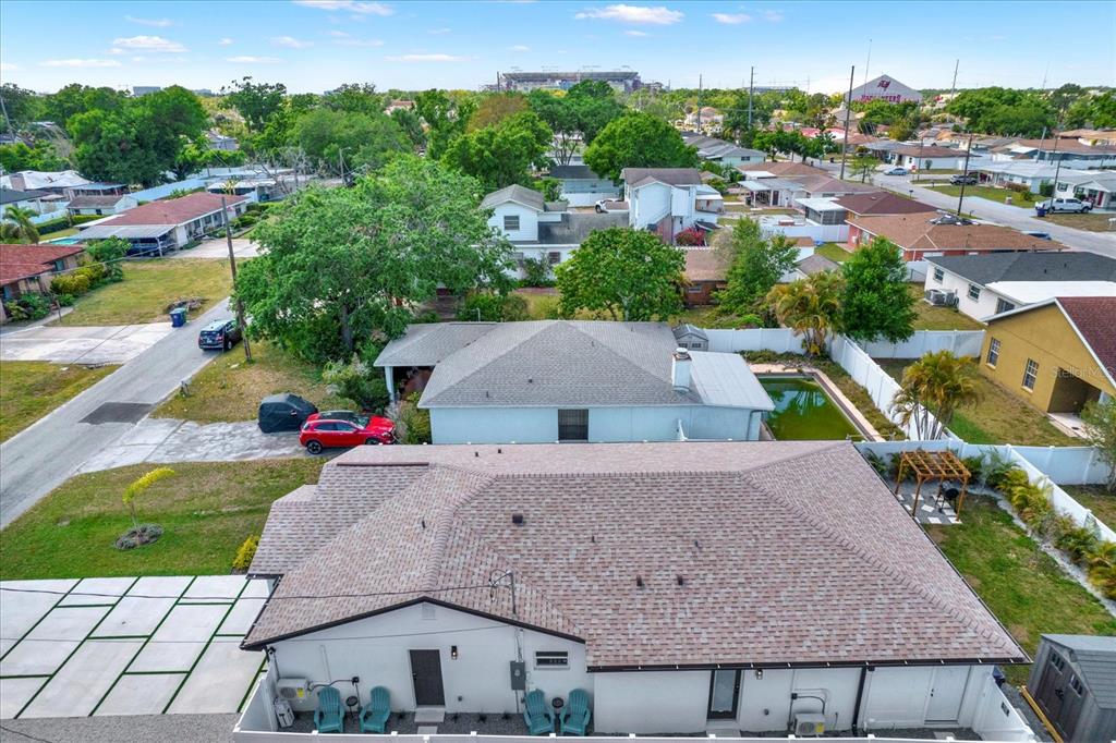 Undisclosed Address Tampa, FL 33607 - Photo 30 of 31 an aerial view of multiple houses with a yard